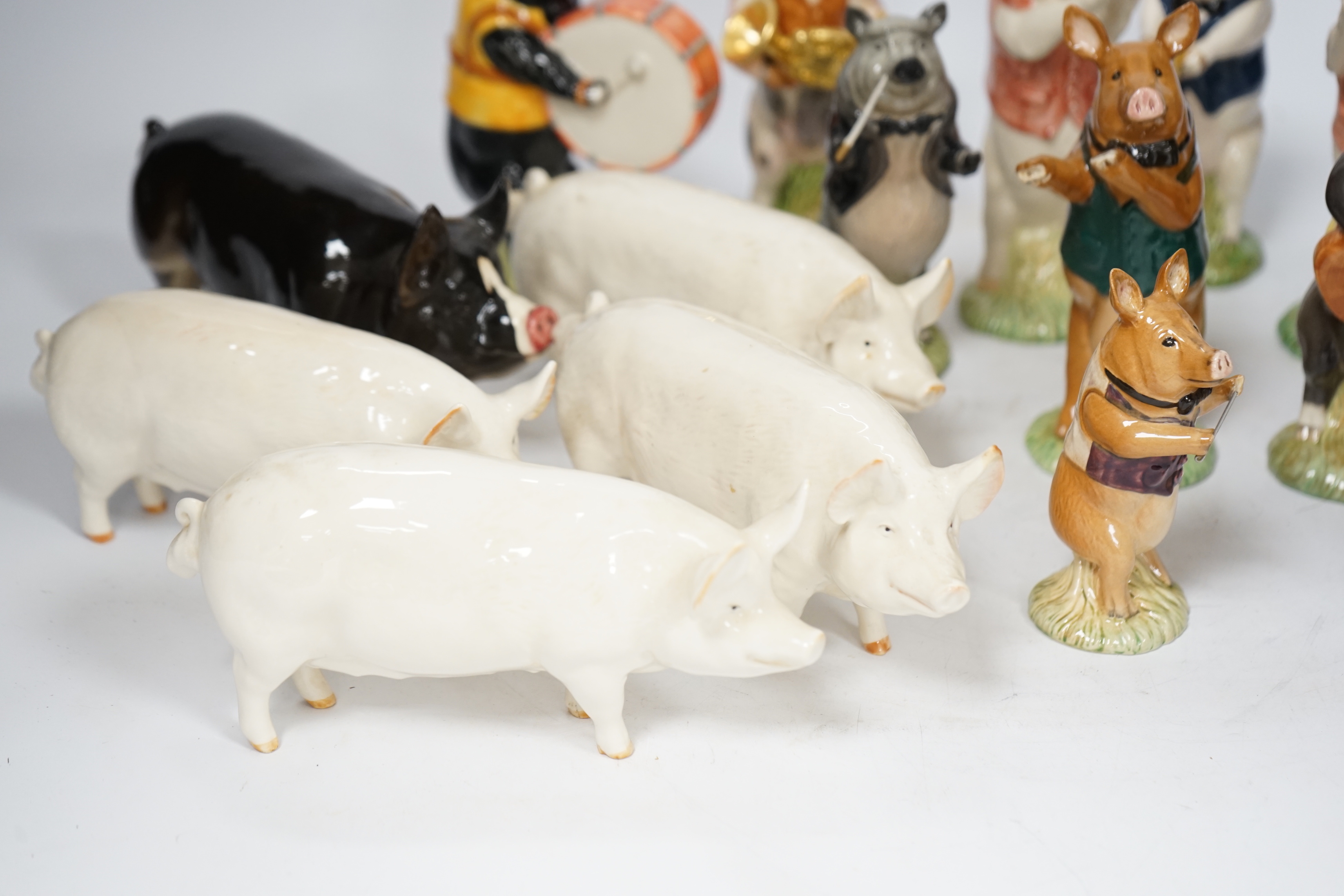 Five Beswick pigs and ten Beswick pig musician band figures